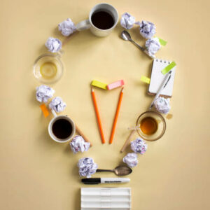 One light bulb icon form by stationaries and crumpled paper ball. IDRAET - BOTANICAL - UVa Malbec Cream - Cr. Facial Regeneradora Refill X 50g